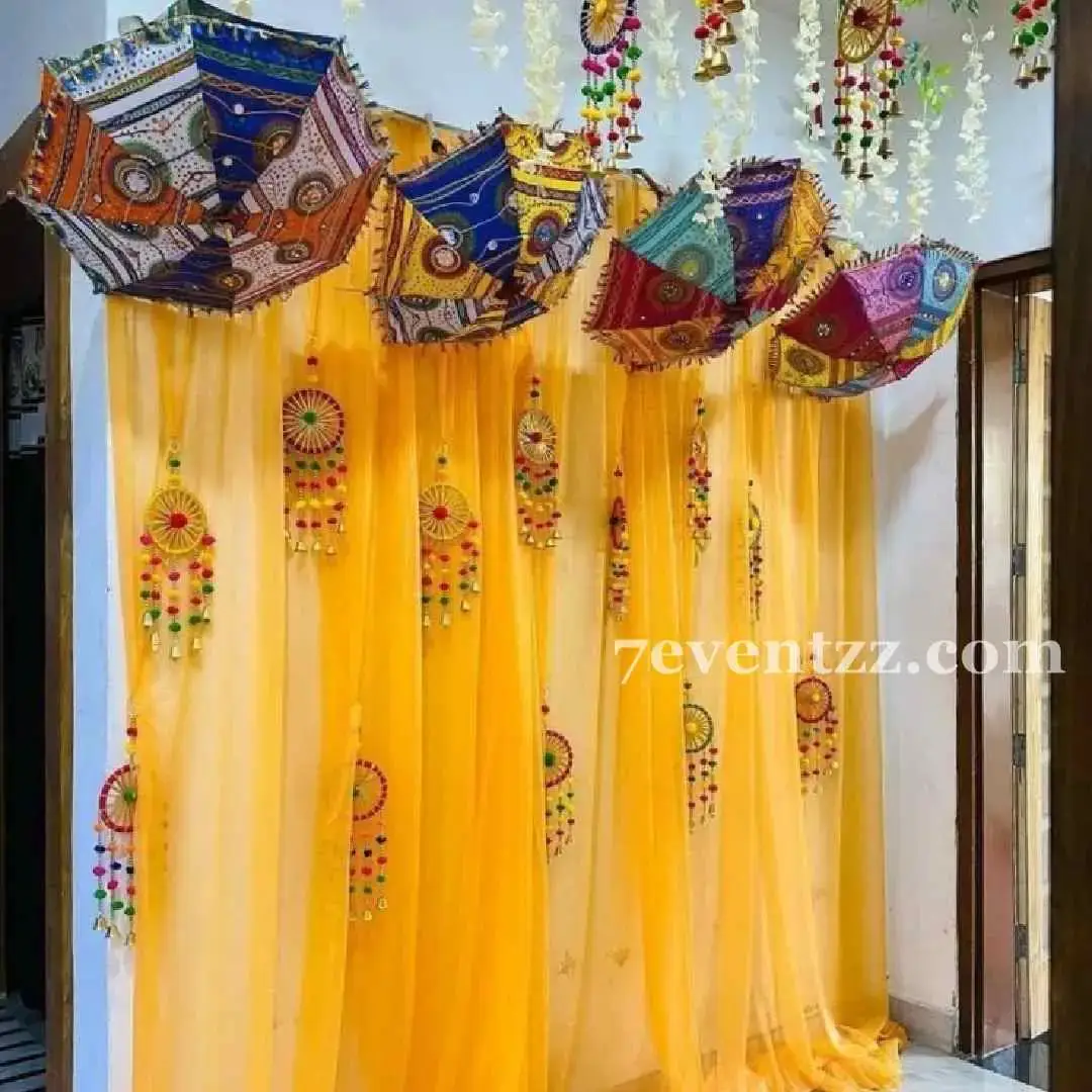 Simple Indoor Haldi Backdrop with orange backdrop on wall — photo 2